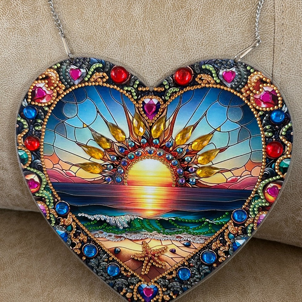 Vibrant Heart-Shaped Sun Art Piece.       Hanging Sun Set